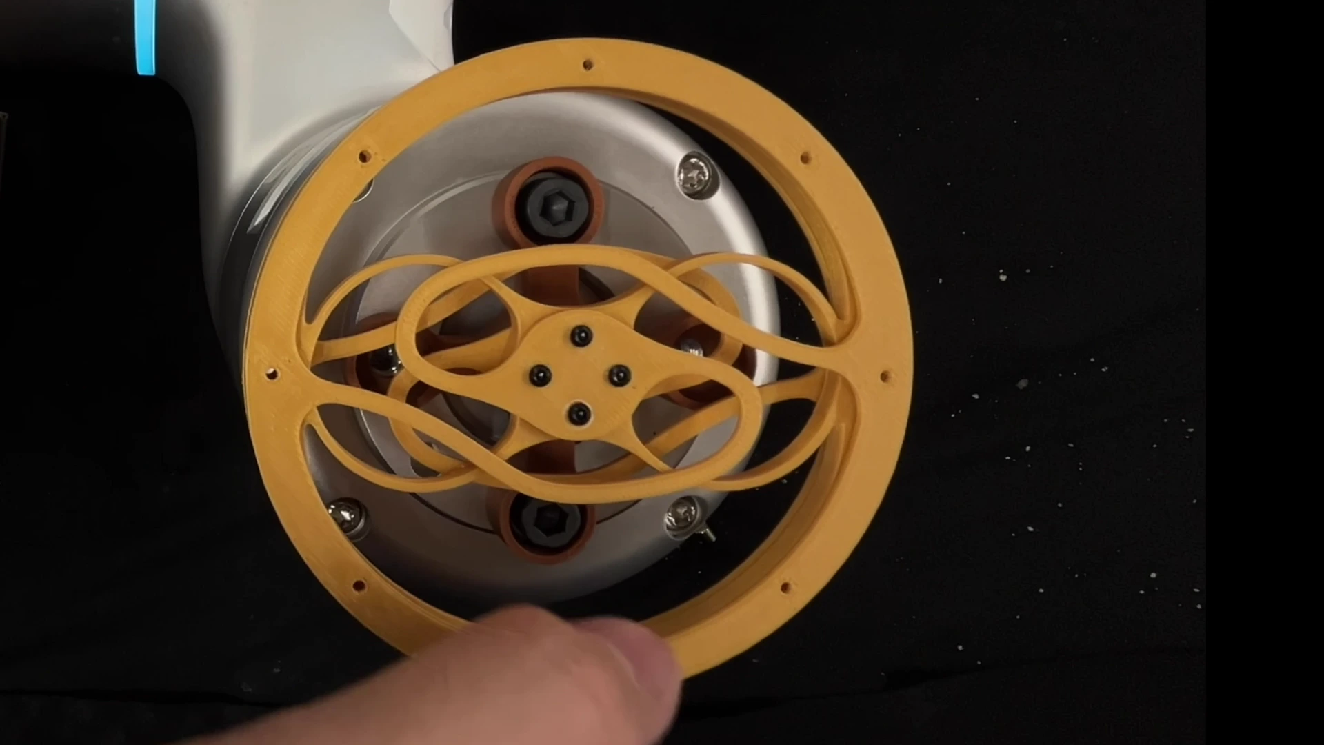 Stacked compliant wrist modules deform under manual loads, with a robot gripper demonstration